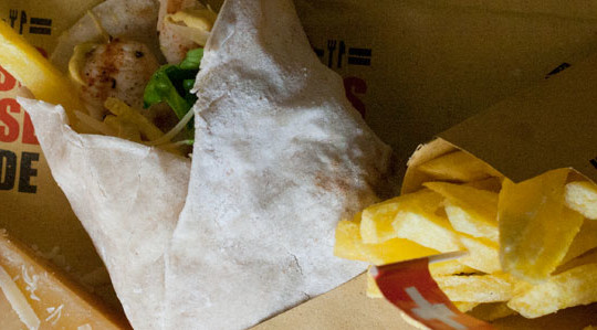 Grilled chicken wrap with grated swiss cheese