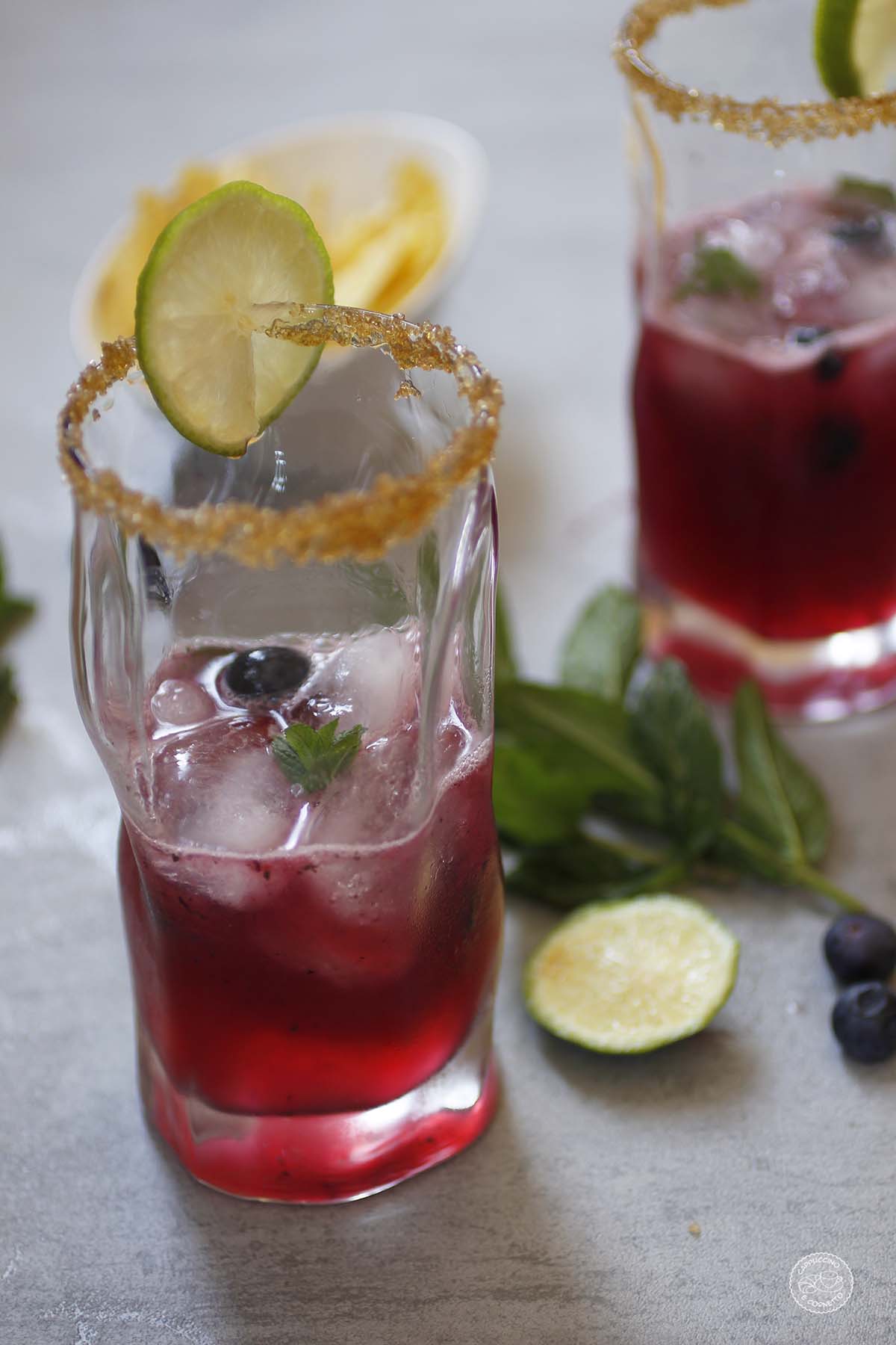 Drink a base di ginger beer, estratto di mirtilli e sciroppo d'acero.